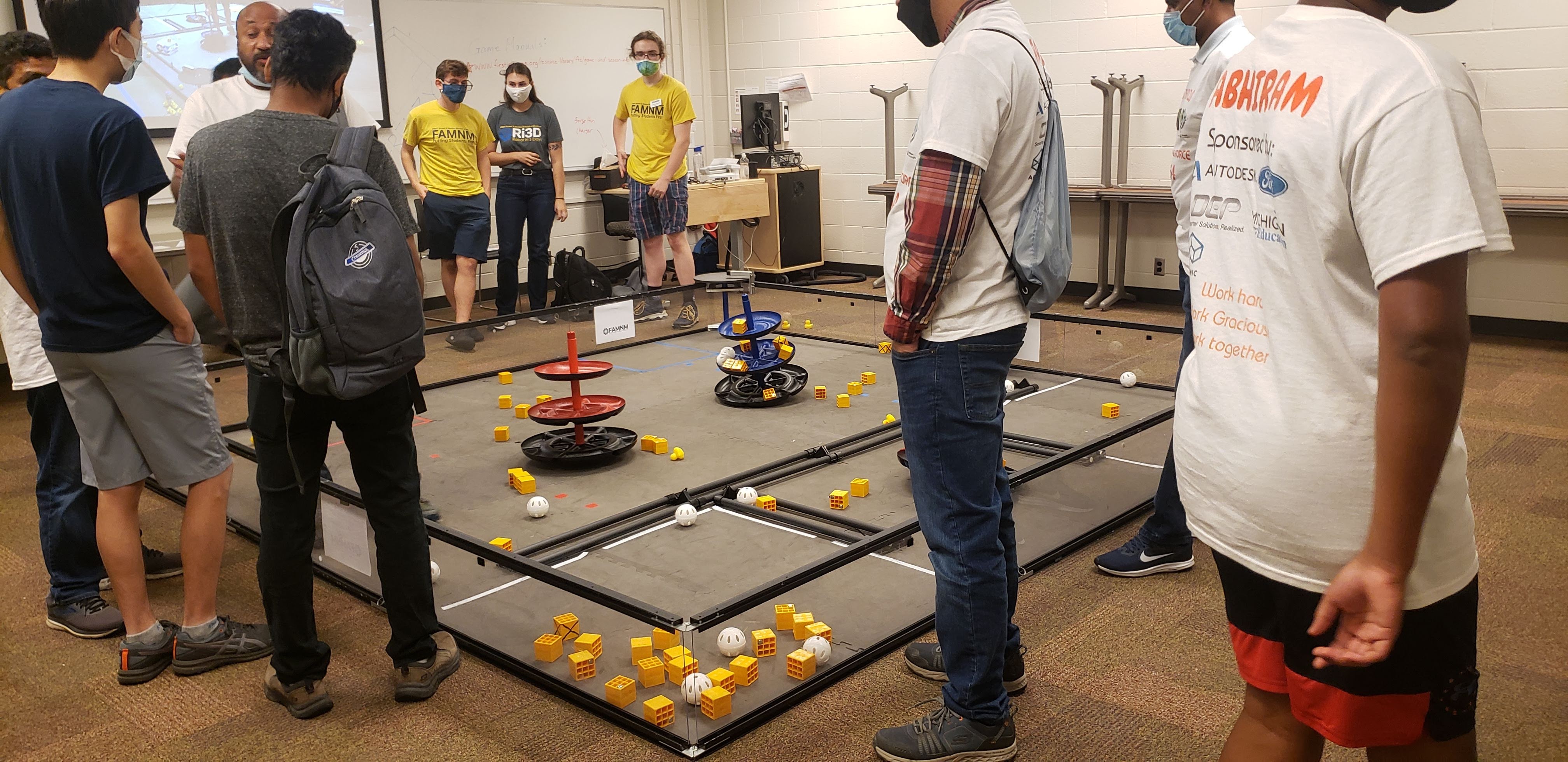 FAMNM volunteers and FTC teams surround the newly revealed game field for Freight Frenzy in 2021